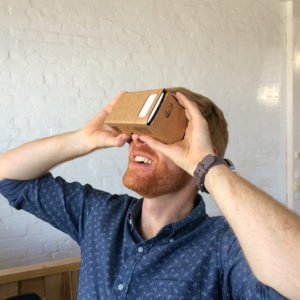 A photo of a user trying Google Cardboard