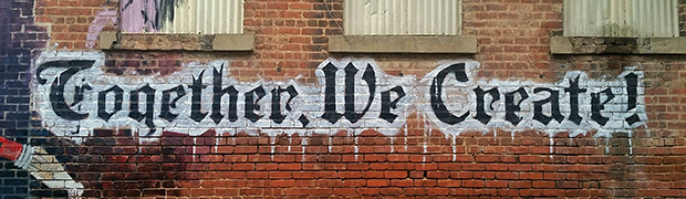 Graffiti reading "Together We Create"