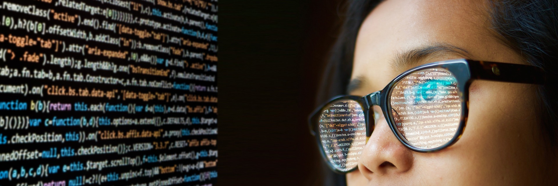 woman with computer code reflected in her spectacles
