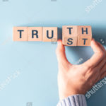 stock-photo-hand-turned-wood-cube-and-changes-the-word-trust-to-truth-1880323426