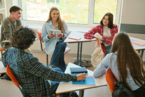 Engaged students discussing ideas in the classroom.