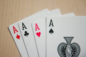A photo of four playing cards. Four aces.