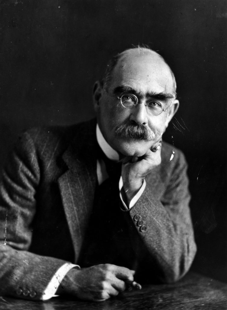 A portrait of Rudyard Kipling looking directly at the camera with his head resting on his left hand