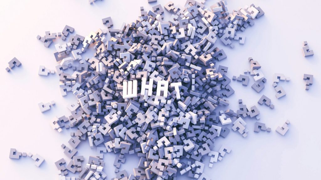 A 3D rendered image of a pile, similar to jigsaw puzzle pieces of question marks. On top of the pile sits the word 'what' in capital letters.